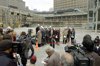 Onlookers tolerate the unveiling ceremony at Ground Zero.